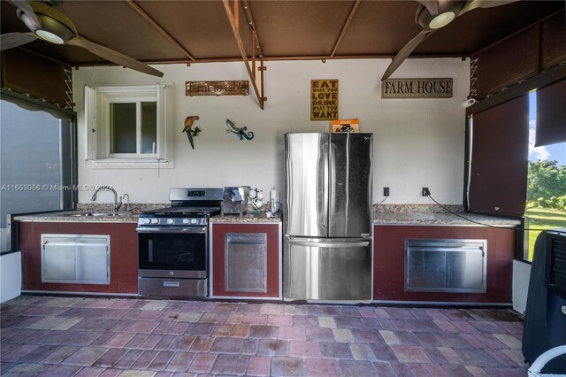 kitchen with ceiling fan, sink, and appliances with stainless steel finishes