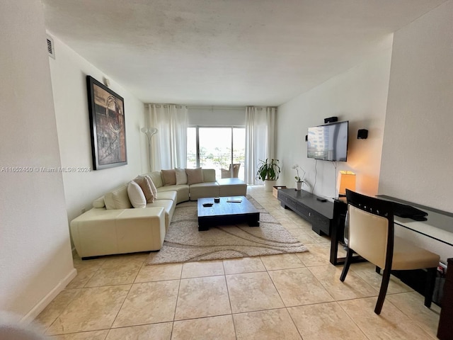 living room with light tile patterned floors