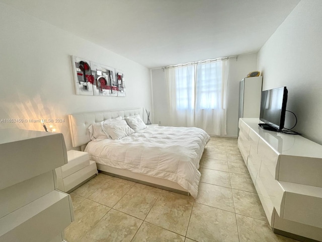 bedroom with light tile patterned flooring