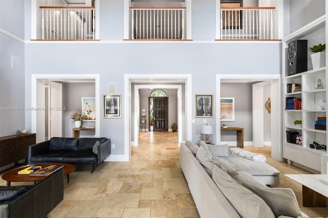 living room featuring a high ceiling