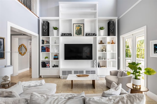 tiled living room featuring a high ceiling