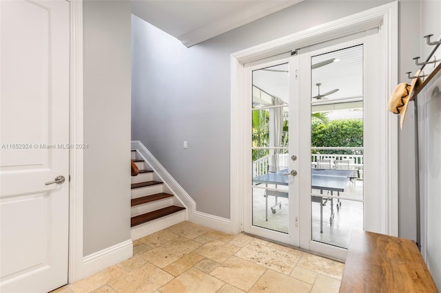 doorway featuring crown molding and french doors