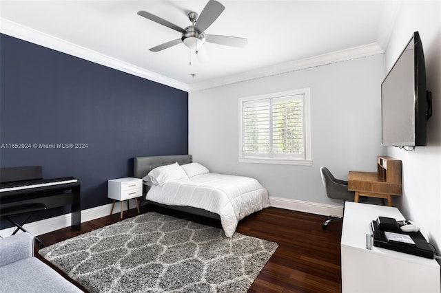 bedroom featuring ceiling fan, dark hardwood / wood-style flooring, and crown molding