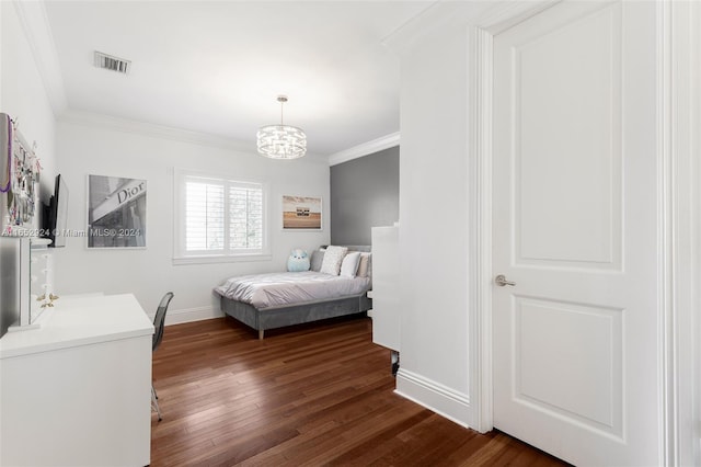 bedroom featuring crown molding, dark wood-type flooring, and an inviting chandelier