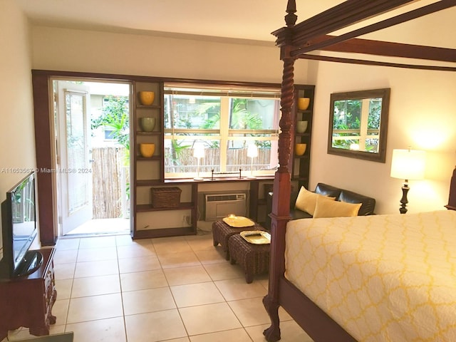 bedroom featuring multiple windows, light tile patterned floors, and access to exterior