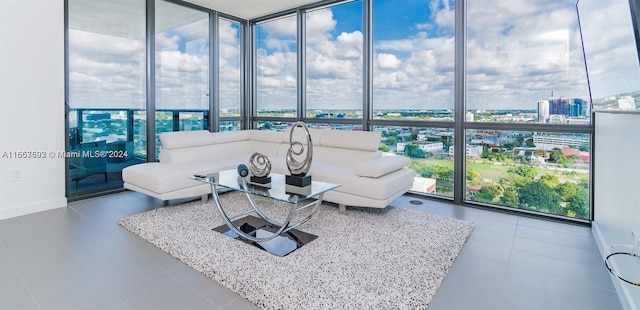 1600 NE 1st Ave Unit 1916, Miami, FL 33132 - living room featuring floor to ceiling windows, baseboards, and tile patterned flooring