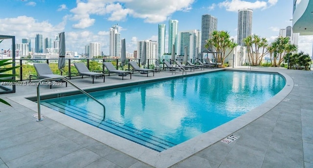 view of swimming pool with a patio area