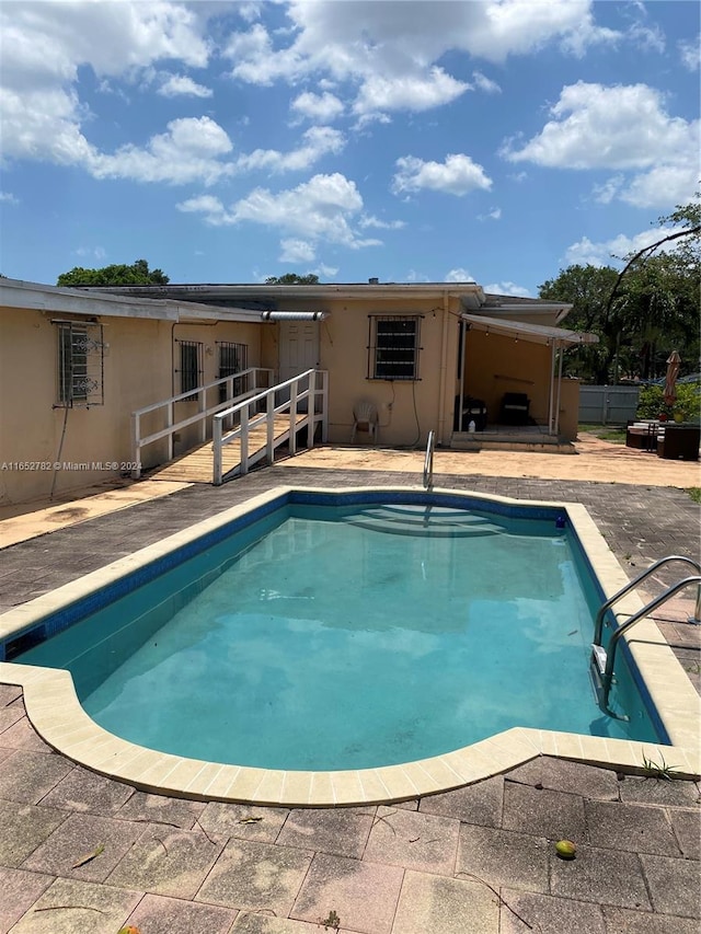 view of pool featuring a patio