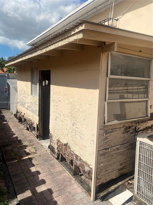 view of side of property with cooling unit