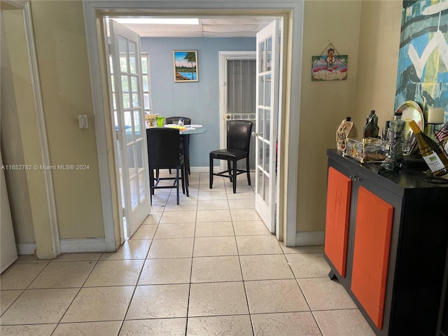 hallway featuring light tile patterned flooring