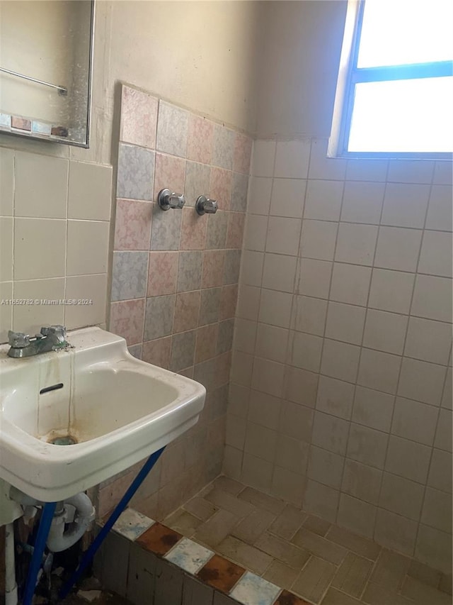 bathroom featuring tile walls and decorative backsplash