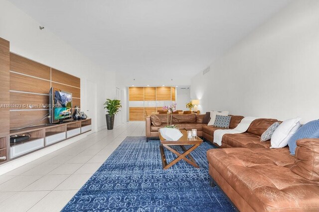 living room with light tile patterned floors