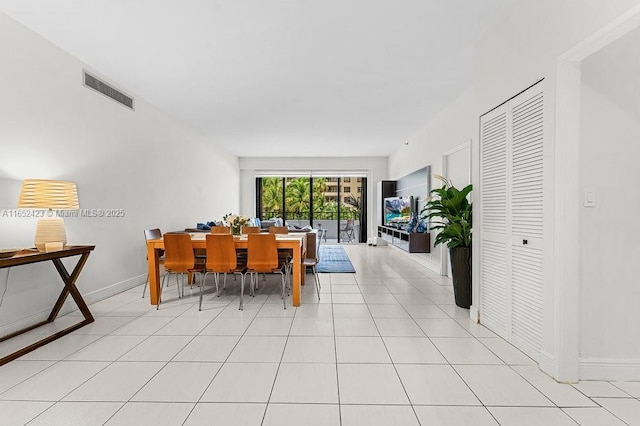 dining space with light tile patterned flooring