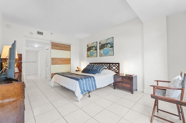 bedroom featuring light tile patterned floors