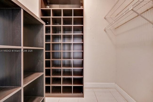 spacious closet featuring tile patterned floors