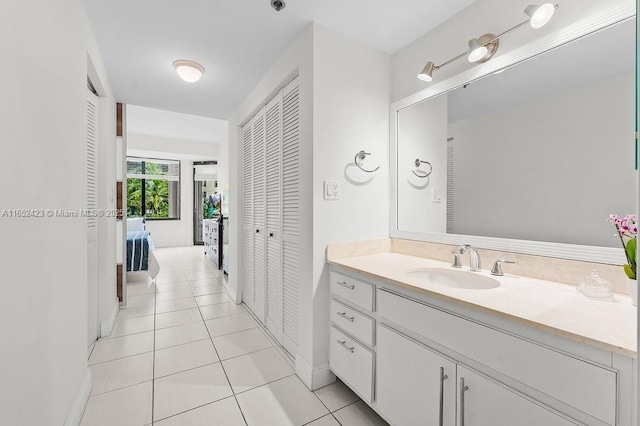 bathroom with tile patterned flooring and vanity