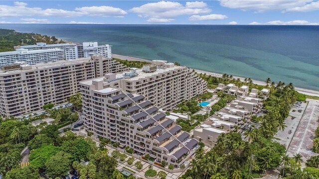 aerial view featuring a water view and a beach view