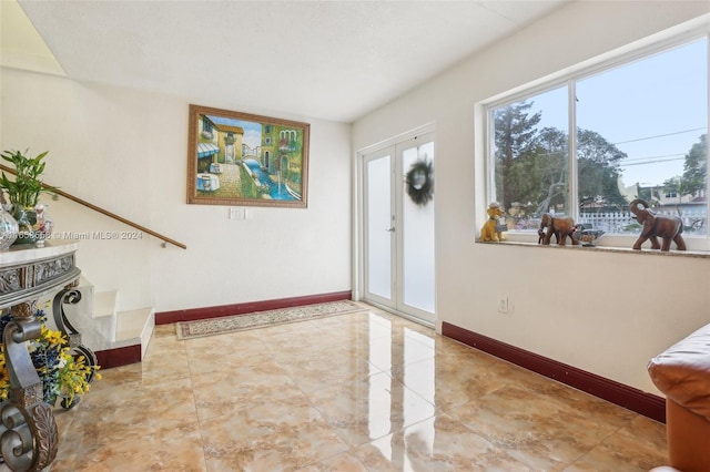 entryway featuring french doors