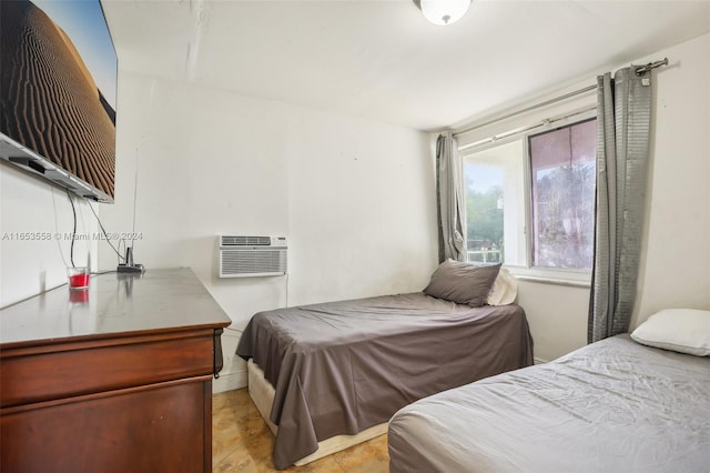 bedroom featuring a wall mounted air conditioner