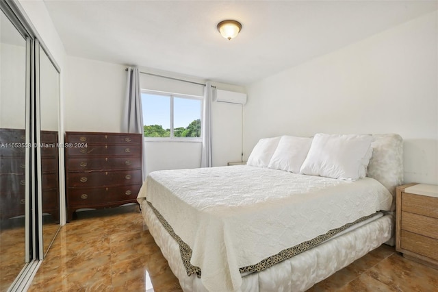 bedroom with a closet and a wall unit AC