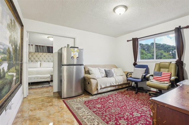 living room with a textured ceiling