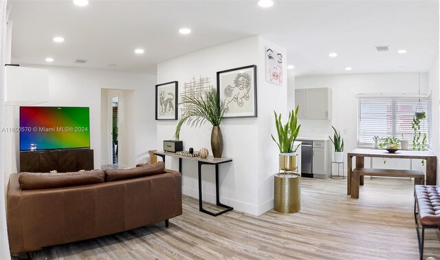 living room with light hardwood / wood-style flooring