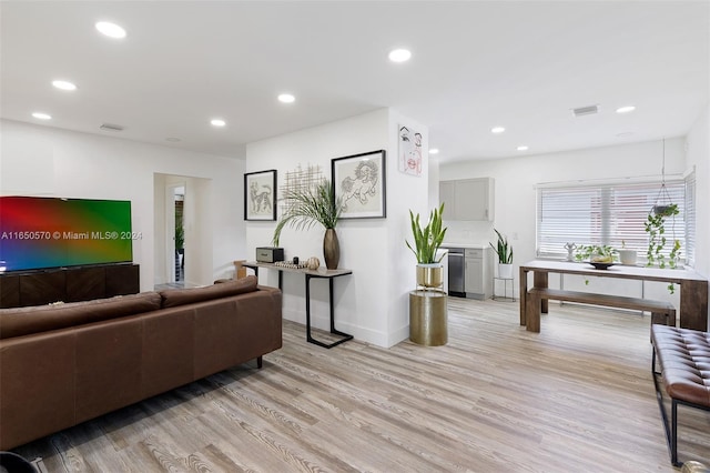 living room with light hardwood / wood-style floors