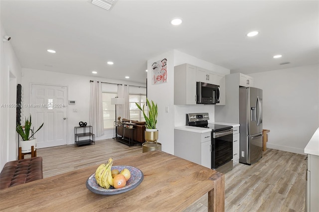 dining room with light hardwood / wood-style floors