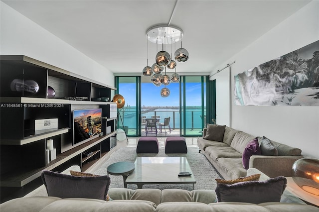 living room featuring expansive windows and a chandelier