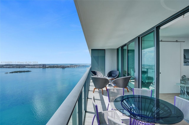 balcony featuring a water view