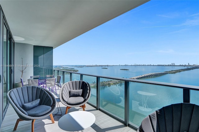 balcony featuring a water view