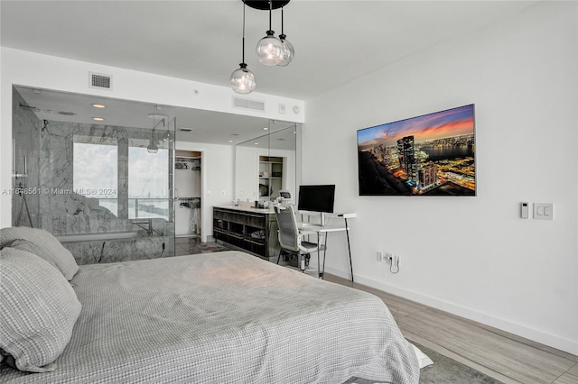 bedroom with hardwood / wood-style floors