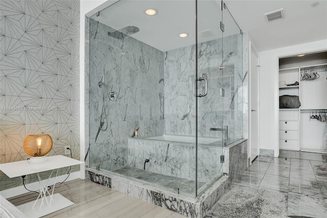 bathroom featuring tile walls and independent shower and bath