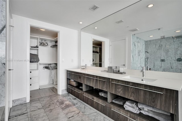 bathroom featuring an enclosed shower and vanity