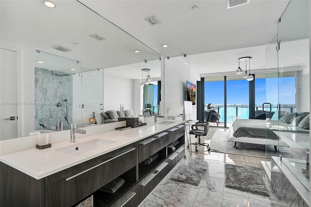 bathroom featuring vanity and an enclosed shower