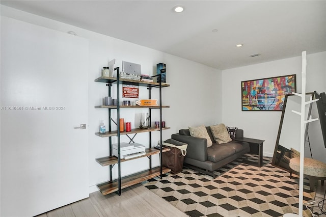 sitting room featuring light hardwood / wood-style flooring