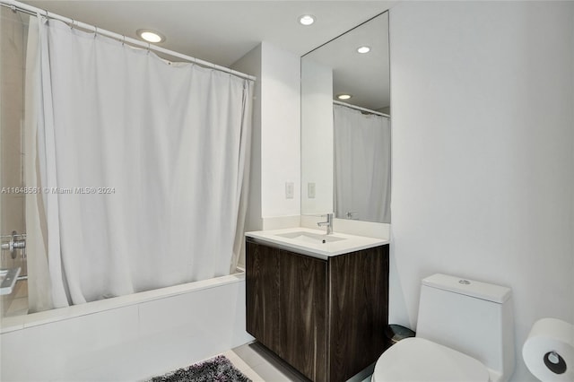 full bathroom with vanity, toilet, and shower / bath combo