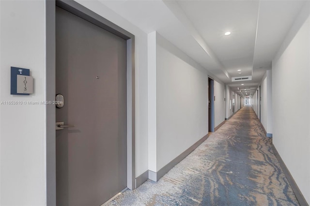 hall featuring carpet floors