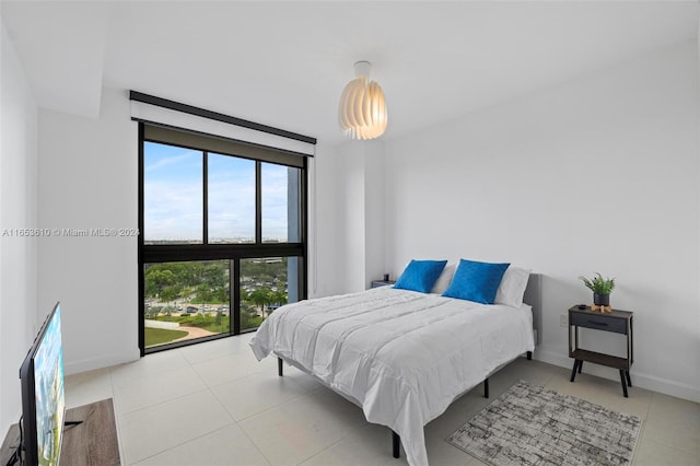 bedroom featuring light tile patterned floors