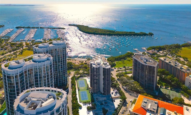 birds eye view of property with a water view