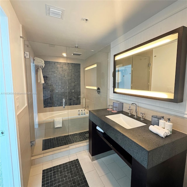 bathroom featuring tile patterned floors, vanity, and plus walk in shower