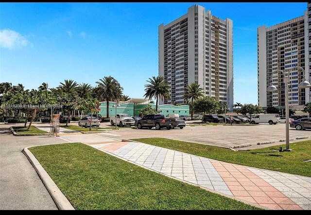 view of property's community featuring a yard