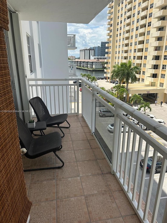 balcony featuring a water view