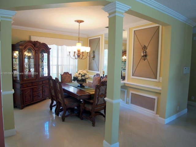 dining area with an inviting chandelier, crown molding, and decorative columns