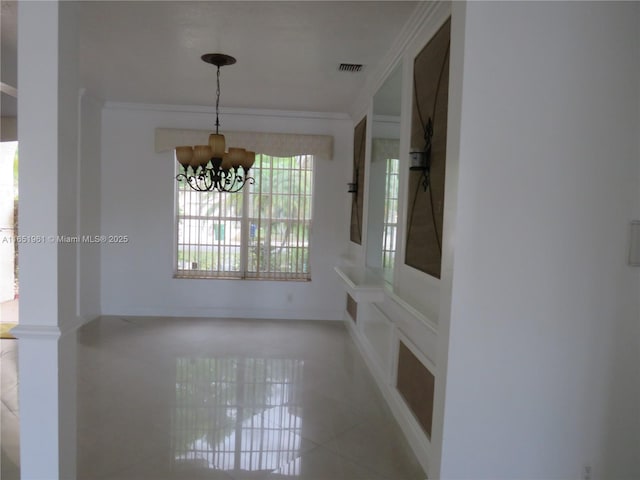 unfurnished dining area with a chandelier, visible vents, tile patterned floors, and ornamental molding