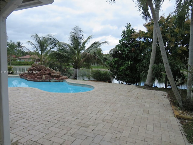 view of pool with a fenced in pool, a patio, and fence