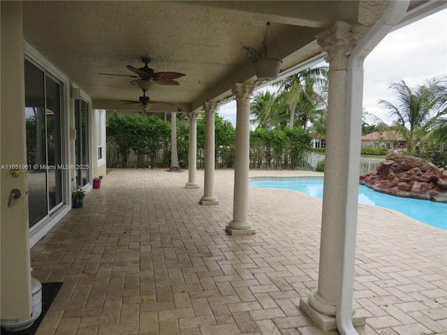 view of swimming pool featuring a fenced in pool, ceiling fan, a patio, and fence