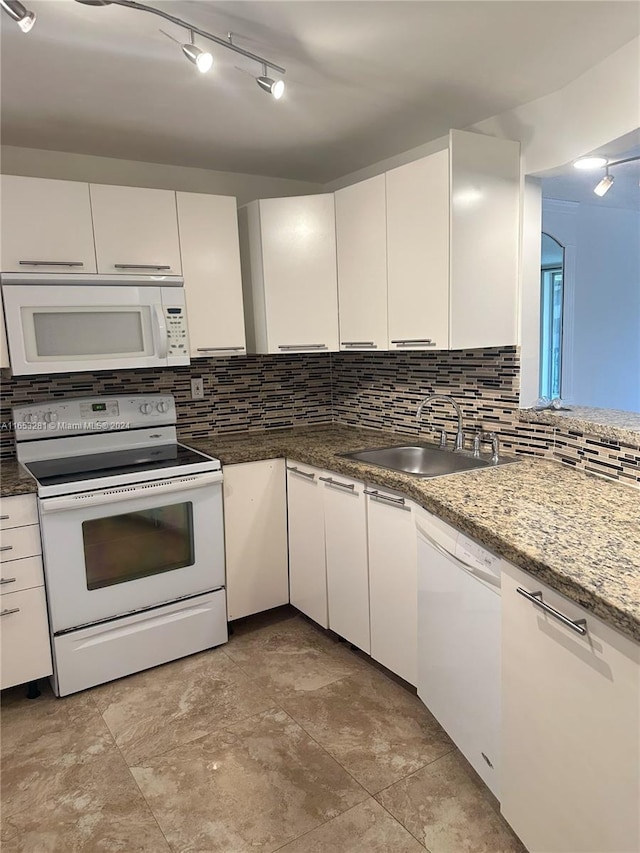 kitchen featuring white cabinetry, white appliances, sink, and tasteful backsplash