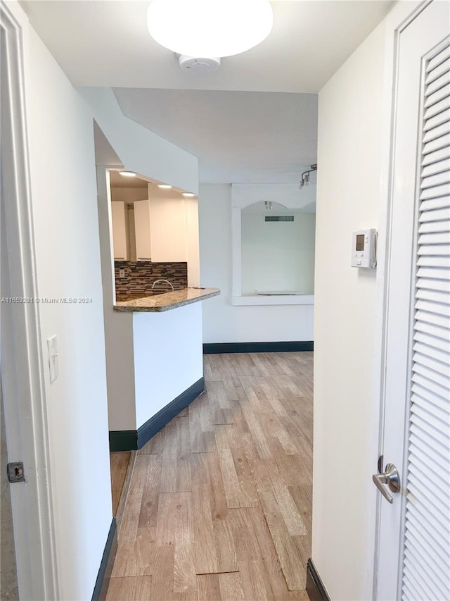 hall featuring light hardwood / wood-style flooring