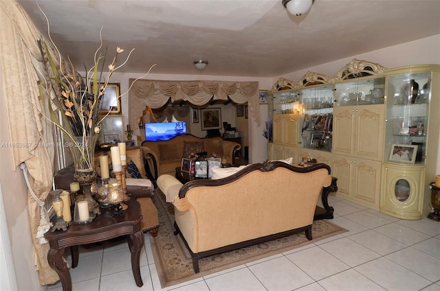 tiled living room featuring washer / dryer